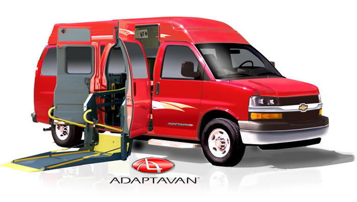 Adaptavan with wheelchair lift depoloyed.  The wheelchair van is red.